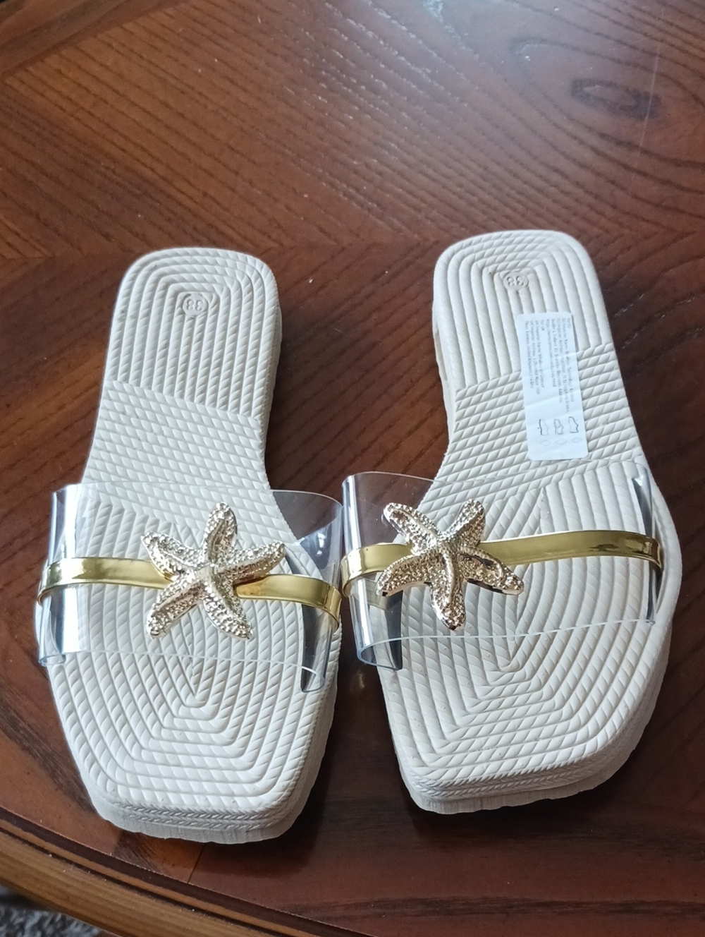 Clear Slide Sandals with Gold Starfish Accent - Women's Cream